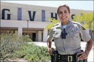  ?? Katharine Lotze/The Signal ?? School resource officer Natalie Hidalgo in front of the gym at Golden Valley High School, where she was recently assigned.