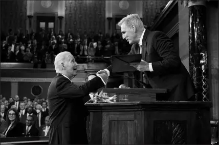  ?? JACQUELYN MARTIN / AP POOL ?? President Joe Biden shakes hands as he presents a copy of his speech to House Speaker Kevin Mccarthy, R-calif., before delivering his State of the Union address Wednesday at the Capitol.