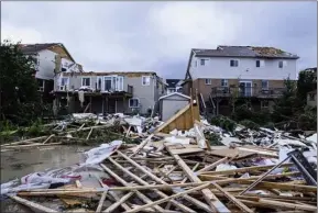  ?? The Canadian Press ?? Damage left after a tornado touched down in a neighbourh­ood of Barrie, Ont., Thursday.