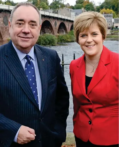  ??  ?? Claims: Alex Salmond, pictured in 2013 with Nicola Sturgeon, denies improper behaviour