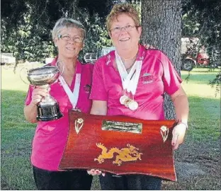  ??  ?? Champs: Matamata breast cancer survivors Ruth Oldershaw and Colleen Harris hold the championsh­ip breast cancer division trophy.