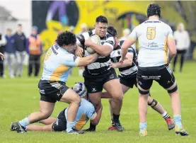  ?? PHOTO: GERARD O’BRIEN ?? Out of my way . . . Southern prop Sunny Mulipola tries to brush off University prop Carlos Policarpio while lock Mitchell Tinnock forms a second line of defence at Bathgate Park on Saturday.