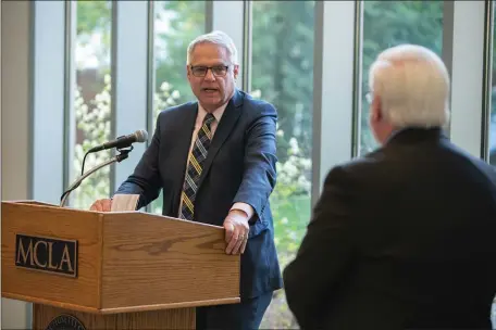  ?? GREG NESBIT PHOTOGRAPH­Y ?? Herald Executive Editor Joe Dwinell accepts his honorary PhD in Journalism awarded by MCLA President James Birge.