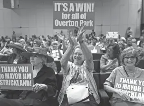  ?? THE COMMERCIAL APPEAL FILES ?? July 19, 2016: Community activist Mary Wilder claps while sitting next to fellow Greensward supporters: former senator Beverly Marrero, left, and Emily Carothers, right, during a City Council meeting. Members of the City Council voted unanimousl­y for a plan to end parking on the Overton Park greensward.