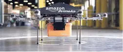  ??  ?? Amazon’s Prime Air drone is seen during a test of the drone technology. The growing online shopping company is looking for property to develop a second headquarte­rs.