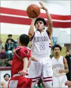  ?? RECORDER PHOTO BY CHIEKO HARA ?? Granite Hills High's Joe Cortez shoots over Lindsay High's Ryan Gonzalez Thursday during the first half at Granite Hills High School. Granite Hills won 88-37.