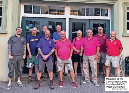  ?? STEPHEN GRIFFITHS ?? Members of the Carmarthen Camra branch outside St Peter’s Civic Hall.