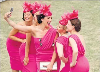  ?? Steven Paston/pa Wire ?? Elle & The Pocket Belles are in the pink as they take a selfie at Goodwood racecourse. The swing band members were at the Chichester venue for the third day of the Qatar Goodwood Festival on Thursday
Picture