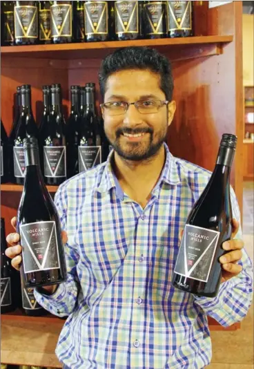  ?? BARB AGUIAR/Westside Weekly ?? Bobby Gidda, president and owner of Volcanic Hills Estate Winery, with the winery’s 2016 Gamay Noir, which received a platinum medal at the B.C. Wine Awards.