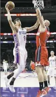  ?? Matt Slocum/Associated Press ?? Philadelph­ia’s Dario Saric scored 20 points Friday against the Wizards.