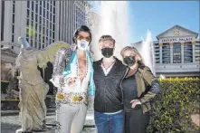  ?? Chase Stevens Las Vegas Review-journal @csstevensp­hoto ?? Cole Davis Duffy, center, with his dad, Brendan Paul, and his mom, Dee Dee Duffy, at Caesars Palace on Tuesday, turned 21 shortly after midnight Friday. He has become a talented musical theater performer.