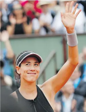  ?? — THE ASSOCIATED PRESS ?? Spain’s Garbine Muguruza celebrates winning her French Open quarter-final against Russia’s Maria Sharapova in two sets 6-2, 6-1, at Roland Garros in Paris, Wednesday.