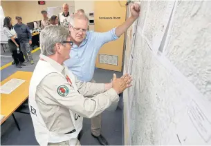  ?? AAP ?? Australian Prime Minister Scott Morrison speaks with staff as he visits the Country Fire Service HQ in Mount Barker yesterday while touring areas affected by the bushfires.