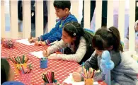  ??  ?? An art competitio­n in progress, where children created drawings depicting what they loved the most about Dubai.