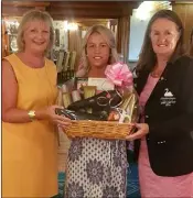  ??  ?? Jackie Hamilton receiving her prize from Maeve Halford and lady Captain Catherine Quinn in Courtown on Tuesday.