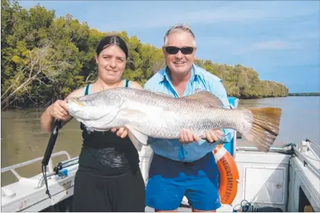 ??  ?? Georgie Spiteri, from Melbourne, with a 103cm barra landed at Adelaide River mouth with Allan Beale of Darwin’s Barra Base