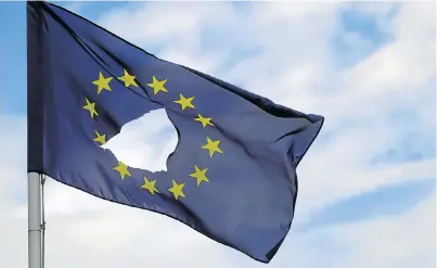  ?? Picture: GETTY IMAGES ?? THAT EMPTY FEELING: An EU flag, with a hole cut in the middle, flies at half-mast outside a home in Knutsford, Cheshire, after the historic referendum this week. EU leaders are pushing for Brexit to start sooner rather than later