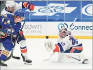  ?? Kevin Hoffman / Getty Images ?? The Islanders’ Semyon Varlamov makes a save against the Sabres’ Cody Eakin on Monday.