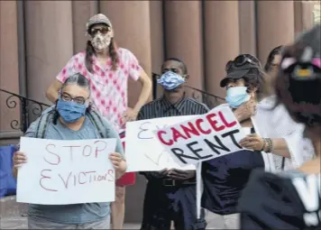  ?? Will Waldron / times union ?? Housing advocates gather outside Albany City Hall monday to call on elected officials to continue an eviction moratorium and rent cancellati­on for the duration of the pandemic.