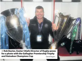  ?? David Rogers ?? > Rob Baxter, Exeter Chiefs Director of Rugby poses for a photo with the Gallagher Premiershi­p Trophy and Heineken Champions Cup