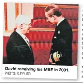  ?? PHOTO: SUPPLIED ?? David receiving his MBE in 2001.