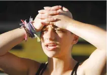  ??  ?? EMMA GONZALEZ, a senior at Marjory Stoneman Douglas High School, speaks to the media after calling for more gun control at a rally three days after the shooting at her school, in Fort Lauderdale, Florida, Feb. 17.