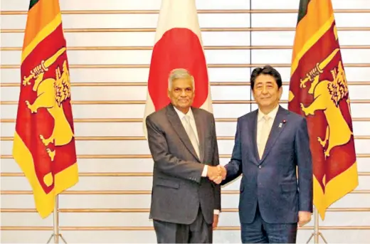  ??  ?? Before finalising the sustainabl­e economic strategy, Prime Minister Ranil Wickremesi­nghe and a top level delegation held extensive talks in Japan to work being warmly greeted by Japan's Prime Minister Shinzo Abe