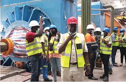  ?? — Picture: Herbert Zharare ?? Zimbabwe Power Company (ZPC) acting managing director, Engineer Kenneth Maswera, (front) leads editors from various publicatio­ns during a tour of thermal powered generator (Unit 7) under constructi­on at Hwange Power Station on Monday. The completion of the units 7 and 8 has been affected by Covid-19 that saw many government­s imposing restrictiv­e measures to help contain the spread of the disease.