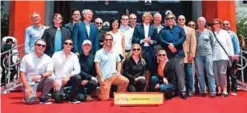  ?? — AFP ?? Filmmaker Michael Bay poses with his ‘crew’ at his Hand and Foot prints ceremony in front of the TCL Chinese Theater in Hollywood, California on May 23, 2017.