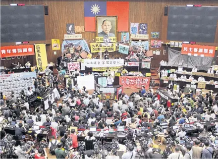  ?? REUTERS ?? Protesters take part in a ‘civic parliament’ inside Taiwan’s Legislativ­e Yuan, its parliament, in April 2014.