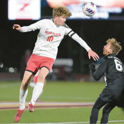  ?? RICK KINTZEL/THE MORNING CALL ?? Moravian Academy’s Trey Sheeler takes control of the ball against Faith Christian on Wednesday during a 1A PIAA semifinal soccer semifinal at Whitehall High School’s Zephyr Stadium.