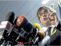  ?? VIRGINIA MAYO/THE ASSOCIATED PRESS Ousted Catalan leader Carles Puigdemont speaks during a media conference in Brussels, Belgium, on Friday. ??