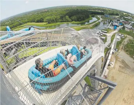  ??  ?? Riders go down the Verruckt ride at the Schlitterb­ahn Waterpark in 2014 in Kansas City, Kan.