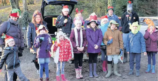  ??  ?? Young Wildlife Explorers, headgear in place, ready for the tree dressing