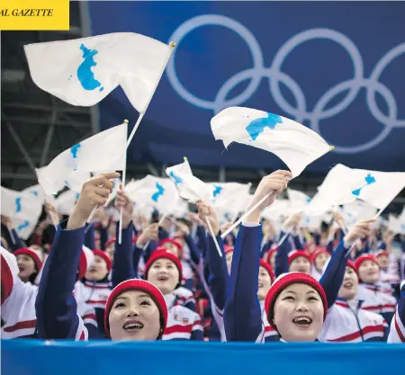  ?? ED JONES / AFP / GETTY IMAGES ?? North Korean cheerleade­rs, seen performing during a hockey game last week, shone some light on the human side of the nuclear-armed state.