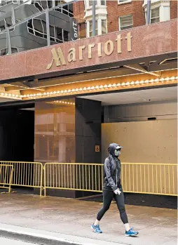  ?? CAYCE CLIFFORD/THE NEW YORK TIMES ?? Business travelers generate about 70% of Marriott’s global revenues, says Robin Farley, lodging analyst at UBS. Marriott is seeing a slow return of domestic bookings.