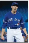  ?? AP/The Canadian Press/ NATHAN DENETTE ?? In their second trade Wednesday, the Houston Astros picked up starter Aaron Sanchez (above) and reliever Joe Biagini from Toronto.