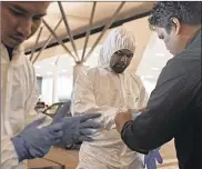  ?? RAHMAN ROSLAN / GETTY IMAGES ?? Forensic teams swept the terminal at Kuala Lumpur Internatio­nal Airport 2 on Saturday for toxic chemicals after they announced on Friday, Kim Jong Nam was poisoned by VX nerve agent.