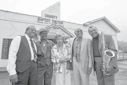  ?? Houston Chronicle ?? Joe “Guitar” Hughes, from left, Johnny Brown, Evelyn Johnson, Milton Hopkins and Grady Gaines reunite in front of the former home of the legendary Duke/Peacock Records in the Fifth Ward in this photo from 1996.