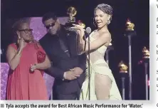  ?? ?? Tyla accepts the award for Best African Music Performanc­e for ‘Water.’