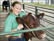  ??  ?? Emma Taylor of Perry has been showing cows for five years, but this year is her third year as a 4-H’er.