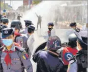  ?? AFP ?? Police use a water cannon against protesters demonstrat­ing against the military coup in Mandalay.