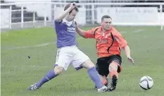  ??  ?? Conwy Borough’s Mike Thompson (right) in recent action against Llandrindo­d Wells