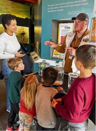  ?? ?? Left: The large animal skeleton displays at the Smithsonia­n National Museum of Natural History are kid favorites. Above: A live insect presentati­on at the Smithsonia­n Museum of Natural History keeps the kids interested.