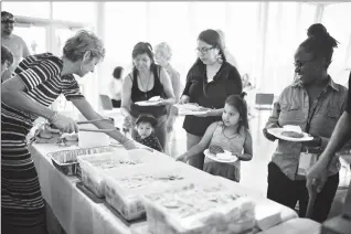  ?? Herald photo by Tijana Martin ?? People gather at the Galt Museum for an Aboriginal Awareness Week Feast on Monday afternoon. @TMartinHer­ald