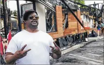  ?? STEVE SCHAEFER / FOR THE AJC ?? “We have so much anxiety and anger because of what white folks do to us on the daily,” said Bo Rodney, 54, of nearby Peoplestow­n, who came by the burned Wendy’s on Sunday.