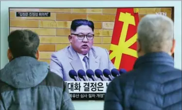  ?? AHN YOUNG-JOON — THE ASSOCIATED PRESS ?? People watch a TV screen showing North Korean leader Kim Jong Un’s New Year’s speech, at Seoul Railway Station in Seoul, South Korea, Wednesday. North Korea announced Wednesday that it will reopen a cross-border communicat­ion channel with South Korea,...