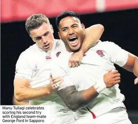  ??  ?? Manu Tuilagi celebrates scoring his second try with England team-mate George Ford in Sapporo