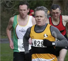  ??  ?? Liam Williams from Ashford AC chased by Kevin Kelleher and Ben Mooney.