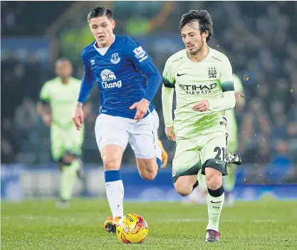  ??  ?? Manchester City’s David Silva, right, during the game against Everton.